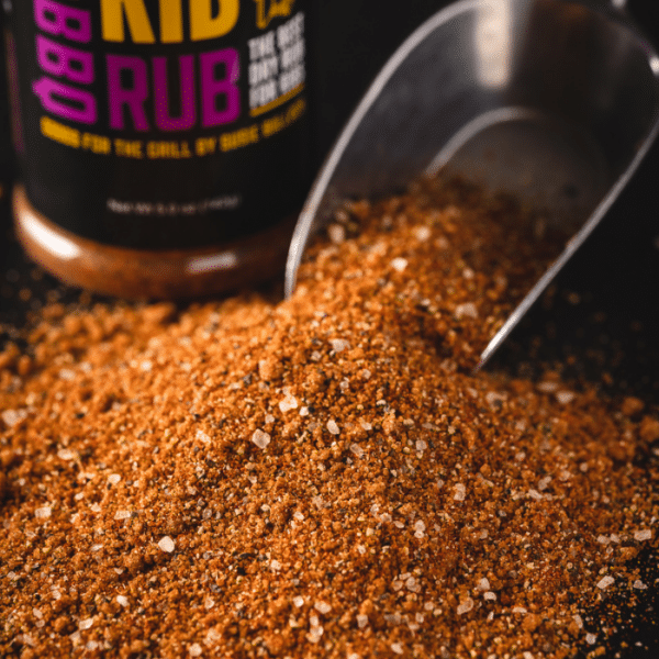Rib rub spilling out of a metal scoop.