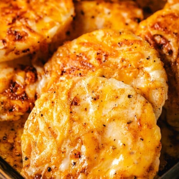 Cooked vegetable coins coated in fried cheese.